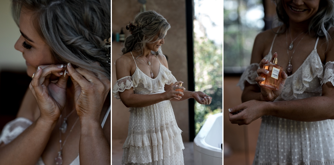 Crystal creek rainforest retreat elopement bride putting perfume on her wrist and earrings with bohoelope