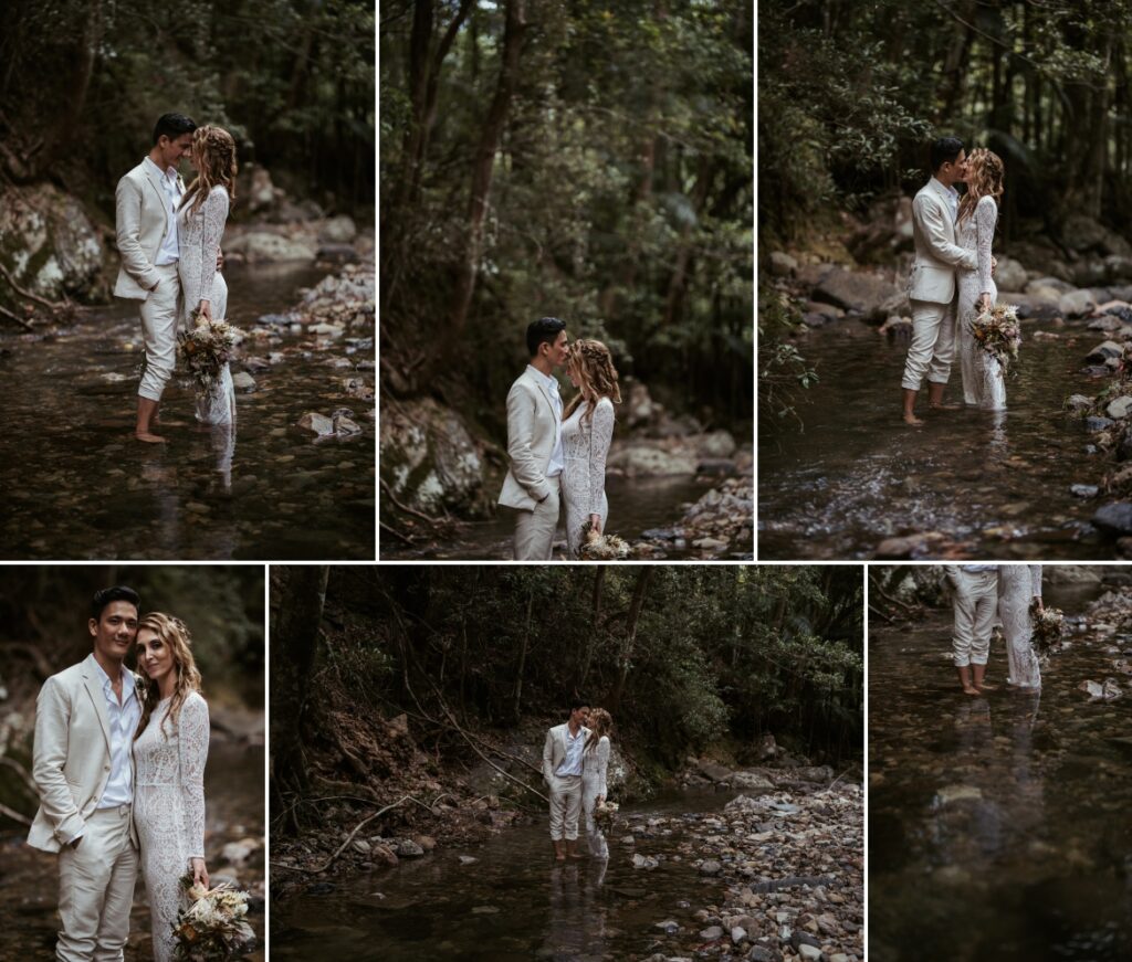 The bride and groom sharing a kiss while standing ankle deep in the creek at crystal creek rainforest retreat. CCRR