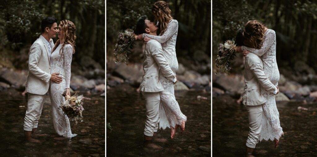 A fun moment in the creek as the groom lifts the bride from the water at crystal creek rainforest retreat. CCRR