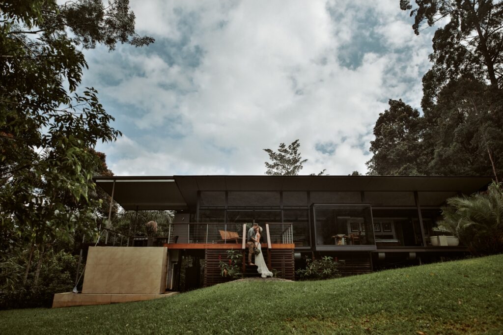 Rainy moody photos of the wedded couple at their accommodation, springbrook mountain view lodge at Crystal creek rainforest retreat, NSW. CCRR