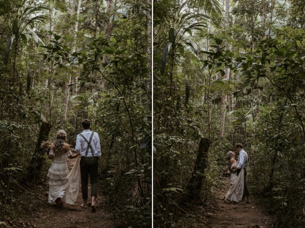 The bride and groom walk through the rainforest ate the crystal creek rainforest retreat. CCRR