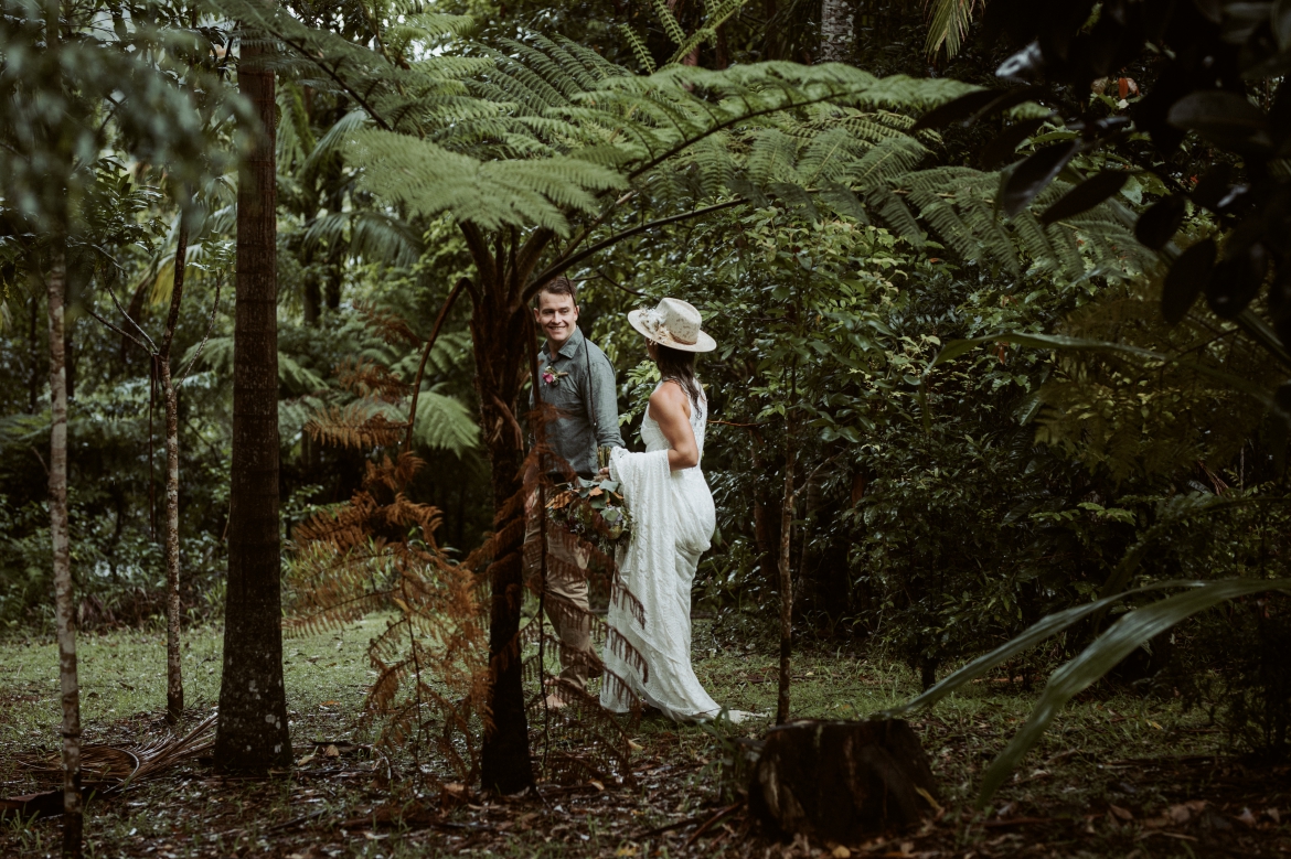 The bride and groom walking around the grounds s of the springbrook mountain view lodge at Crystal creek rainforest retreat, NSW. CCRR